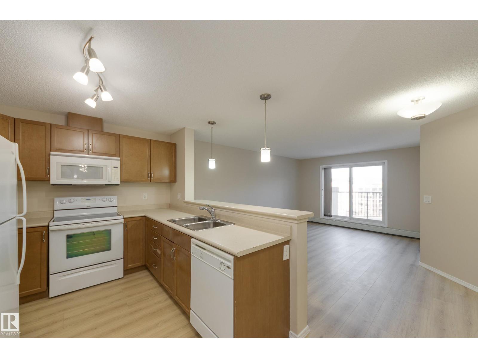 MLS® listing #29572411 for sale located at #404 6070 SCHONSEE WY NW