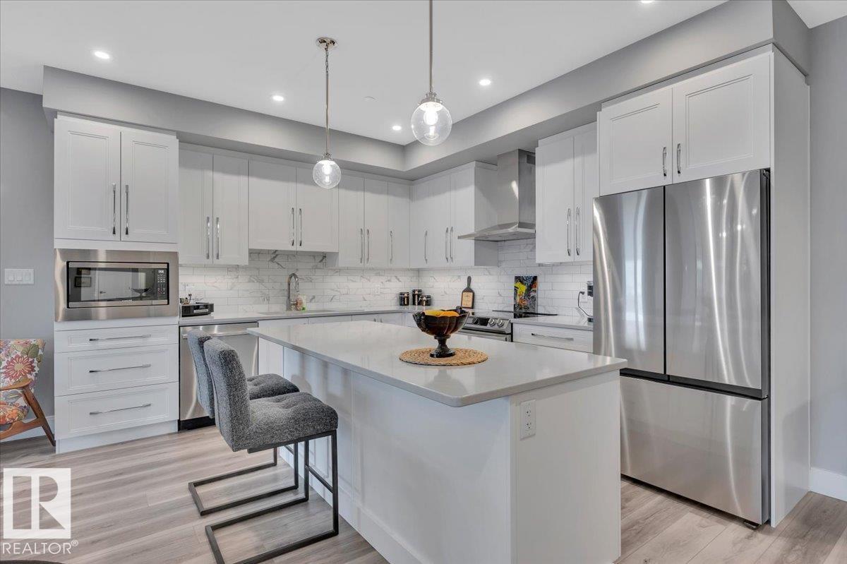 MLS® listing #29624594 for sale located at #404 7463 MAY CM NW NW