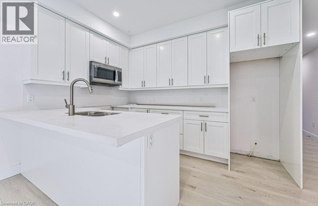 MLS® listing #29984349 for sale located at 64 GAGE Avenue Unit# 1
