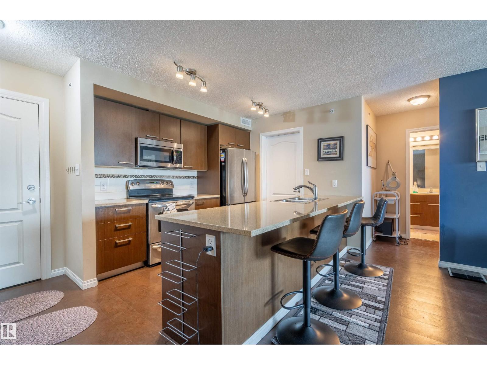 MLS® listing #29988706 for sale located at #2401 7343 SOUTH TERWILLEGAR DR NW