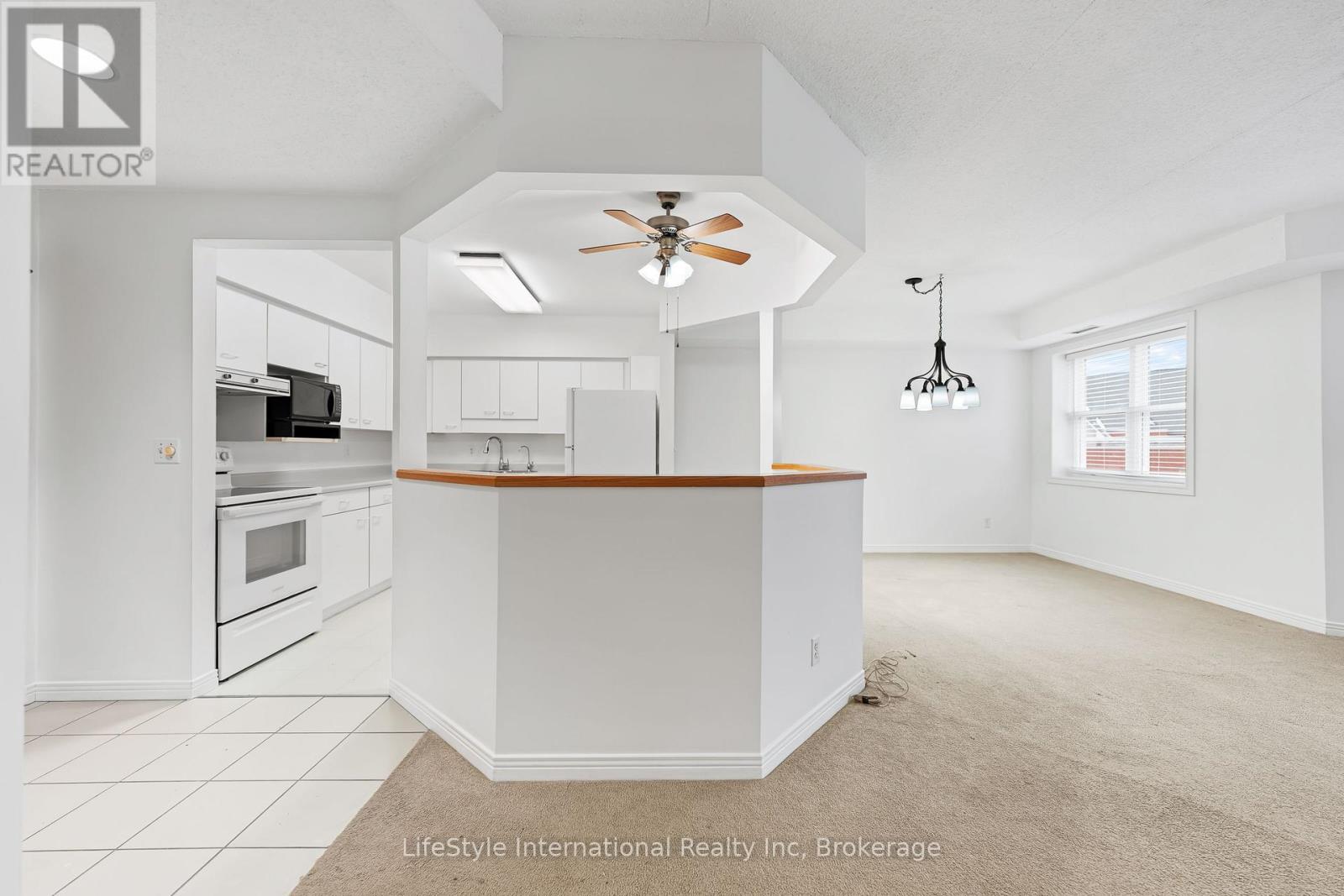 MLS® listing #30103859 for sale located at 205 - 208 SILVERCREEK PARKWAY N