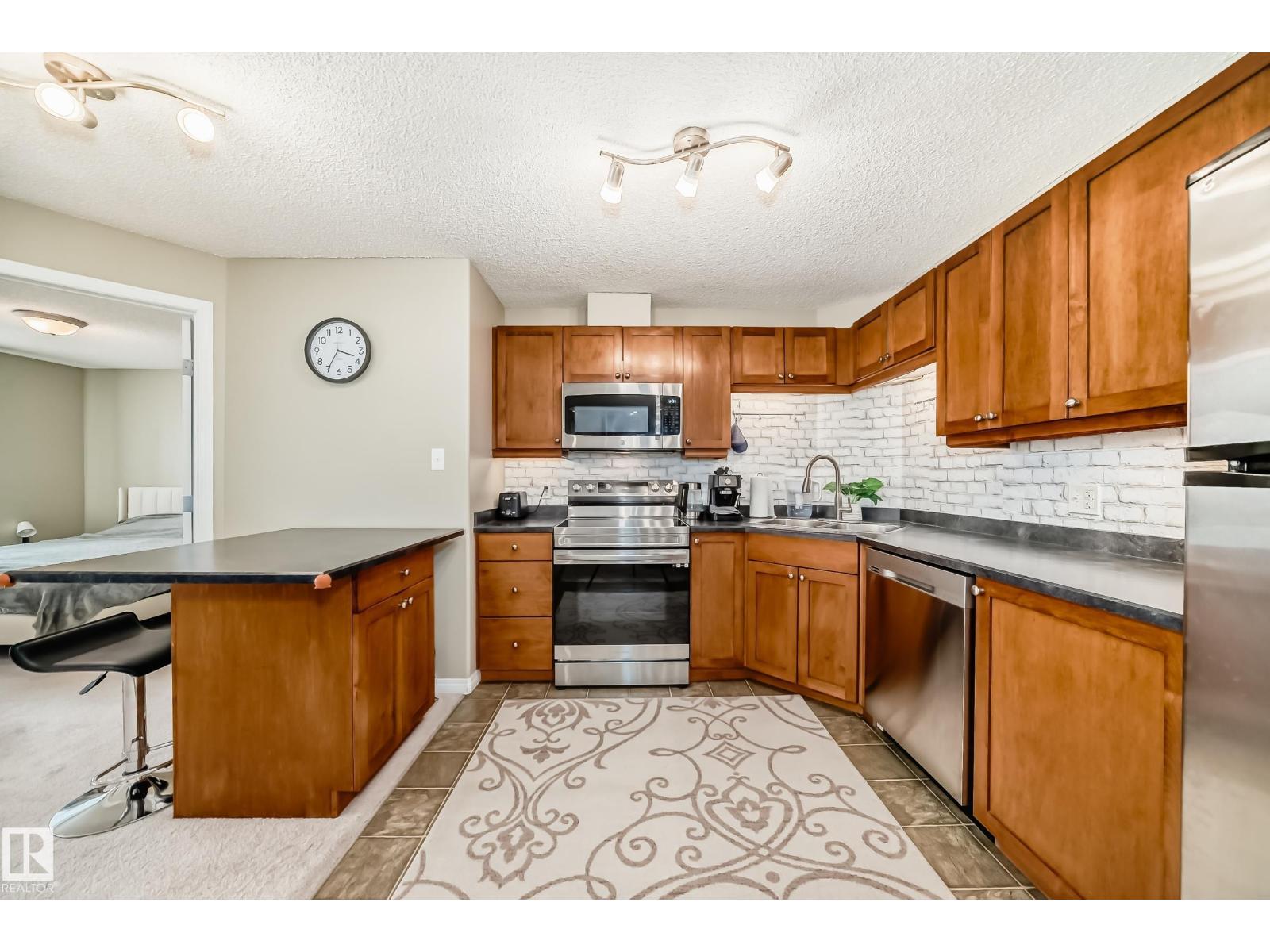 MLS® listing #30233328 for sale located at #1309 7339 SOUTH TERWILLEGAR DR NW