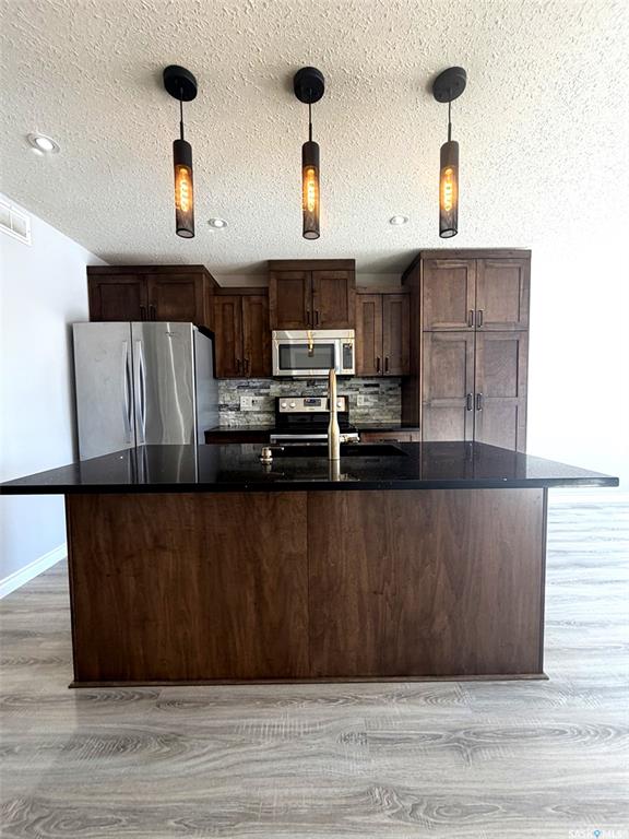 Third View of 103 Plains Circle, Pilot Butte, Saskatchewan, S0G 3Z0